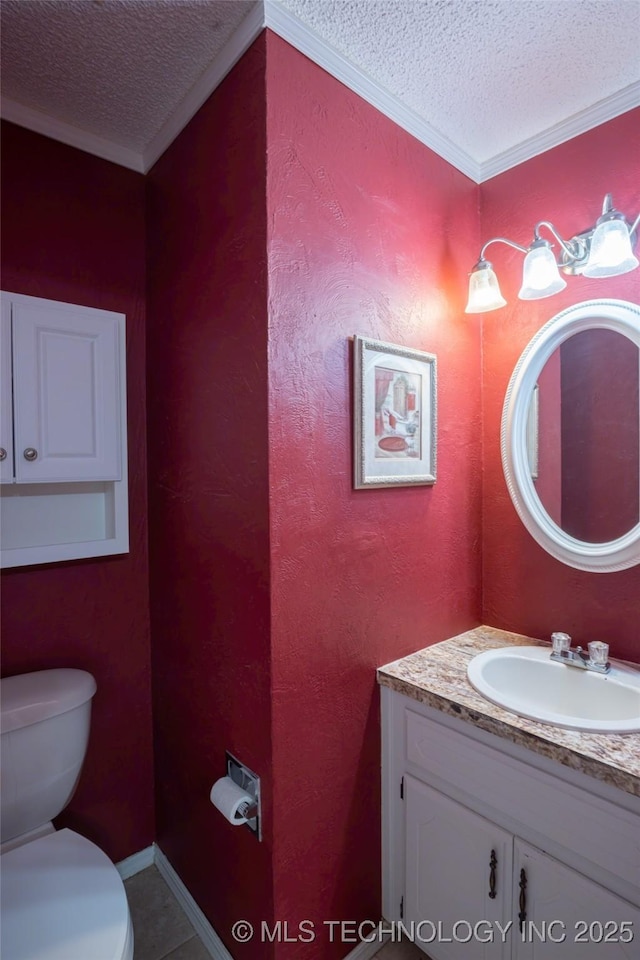 1408 11th NW, Ardmore, OK 73401 - bathroom with a textured ceiling, vanity, ornamental molding, and tile patterned floors