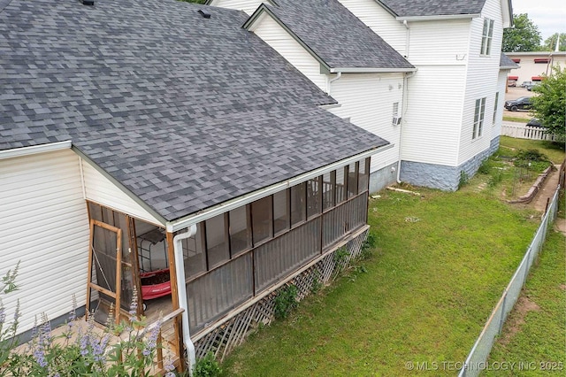 210 S Water St, Sapulpa, OK 74066 - rear view of property with a shingled roof and a sunroom