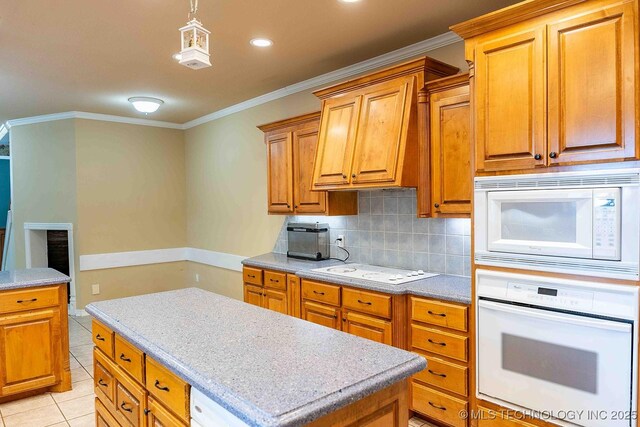 210 S Water St, Sapulpa, OK 74066 - kitchen featuring white appliances, tasteful backsplash, ornamental molding, light countertops, and light tile patterned floors