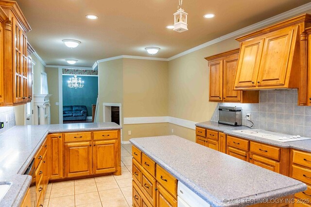 210 S Water St, Sapulpa, OK 74066 - kitchen with light tile patterned floors, backsplash, white cooktop, crown molding, and light countertops