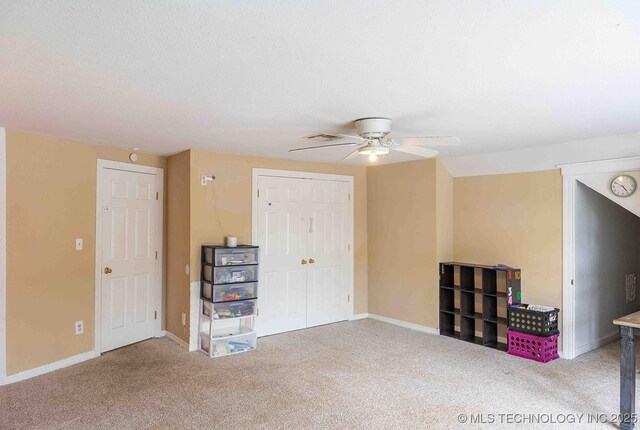210 S Water St, Sapulpa, OK 74066 - unfurnished living room featuring ceiling fan, carpet, and baseboards