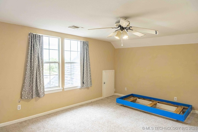210 S Water St, Sapulpa, OK 74066 - unfurnished bedroom with carpet flooring, multiple windows, baseboards, and lofted ceiling