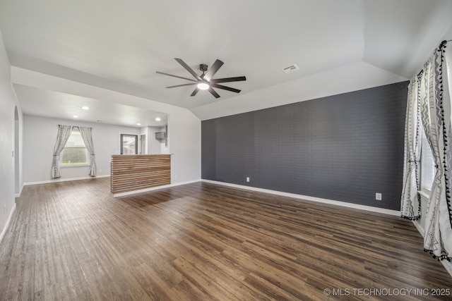 5976 E 147th St S, Bixby, OK 74008 - unfurnished living room featuring brick wall, ceiling fan, dark wood finished floors, lofted ceiling, and baseboards