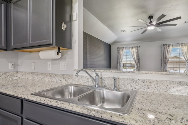 5976 E 147th St S, Bixby, OK 74008 - kitchen featuring a sink, ceiling fan, gray cabinets, and vaulted ceiling