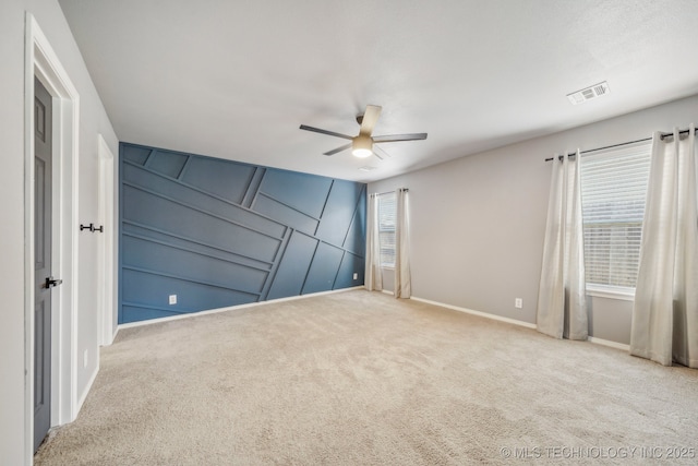 5976 E 147th St S, Bixby, OK 74008 - unfurnished bedroom featuring a decorative wall, carpet floors, baseboards, and ceiling fan