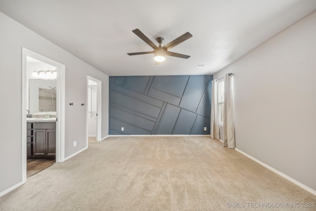 5976 E 147th St S, Bixby, OK 74008 - unfurnished bedroom with carpet, baseboards, a decorative wall, and ceiling fan