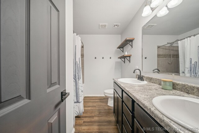 5976 E 147th St S, Bixby, OK 74008 - full bathroom featuring double vanity, a shower with curtain, wood finished floors, baseboards, and toilet