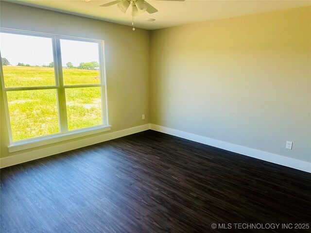 99 Treaty, Calera, OK 74730 - empty room featuring ceiling fan, plenty of natural light, baseboards, and dark wood-style flooring