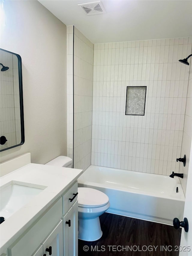 99 Treaty, Calera, OK 74730 - bathroom with vanity, toilet, wood finished floors, and washtub / shower combination