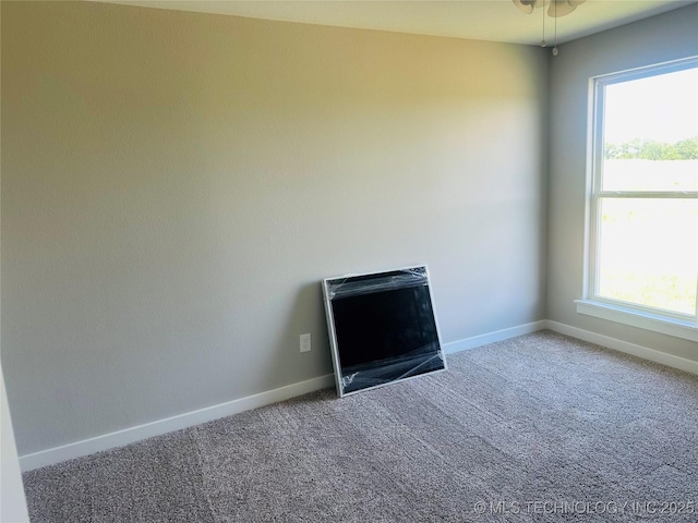 99 Treaty, Calera, OK 74730 - carpeted spare room with baseboards, a fireplace, and healthy amount of natural light