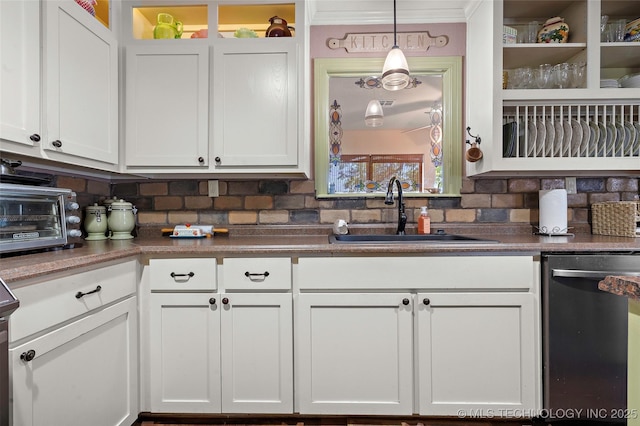 6472 Kings Rd, Ardmore, OK 73401 - kitchen with stainless steel dishwasher, a sink, and white cabinetry