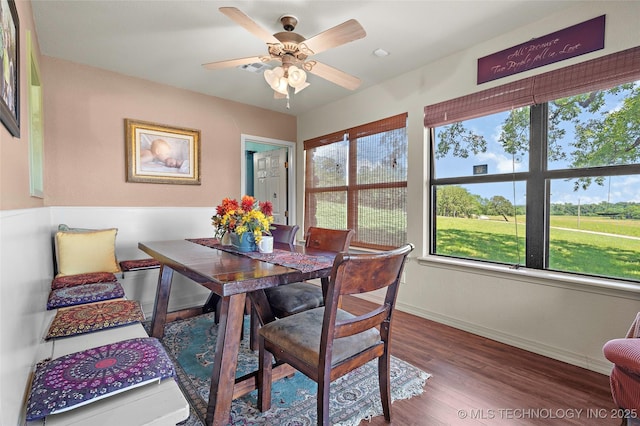 6472 Kings Rd, Ardmore, OK 73401 - dining area featuring baseboards, wood finished floors, and a ceiling fan
