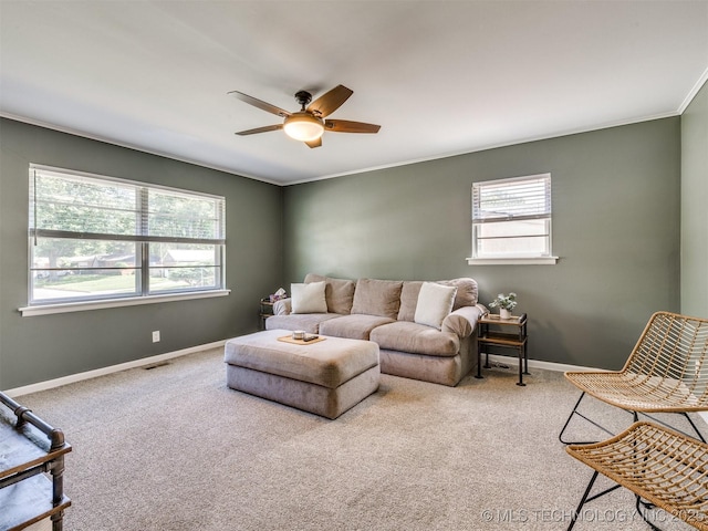 1518 E 58th St, Tulsa, OK 74105 - carpeted living room featuring ceiling fan, healthy amount of natural light, baseboards, and crown molding