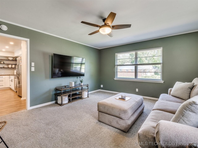 1518 E 58th St, Tulsa, OK 74105 - living room with light carpet, ceiling fan, baseboards, and ornamental molding