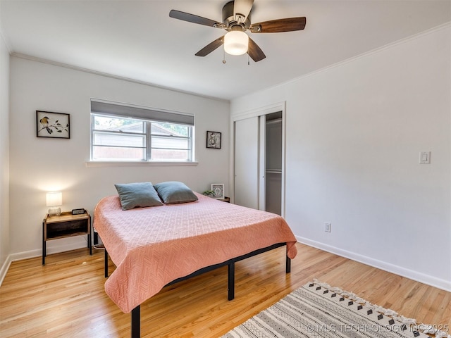 1518 E 58th St, Tulsa, OK 74105 - bedroom featuring a closet, light wood finished floors, baseboards, and ceiling fan