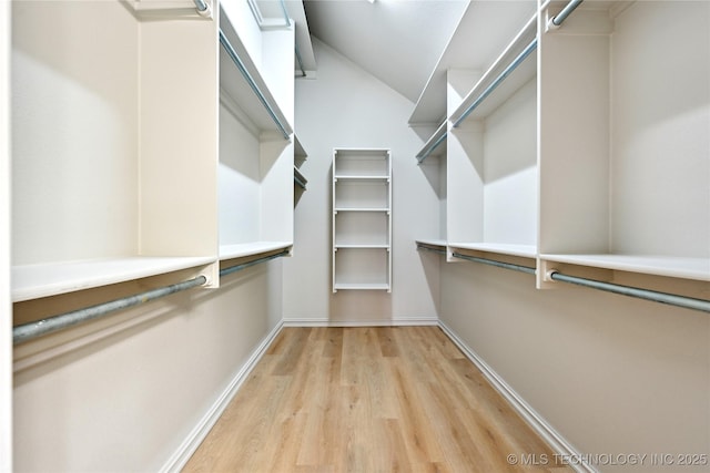 4701 S 179th E Ave, Tulsa, OK 74134 - walk in closet featuring light wood finished floors and vaulted ceiling