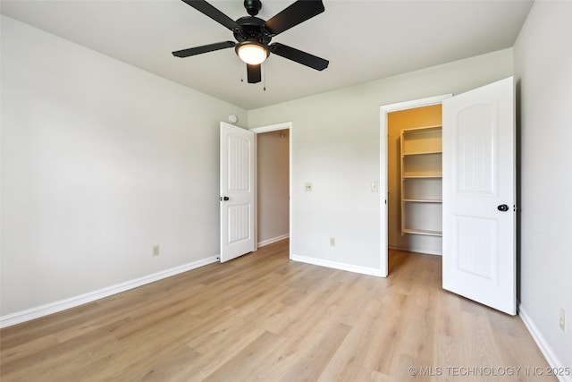 4701 S 179th E Ave, Tulsa, OK 74134 - unfurnished bedroom with a spacious closet, light wood-style floors, baseboards, and a closet