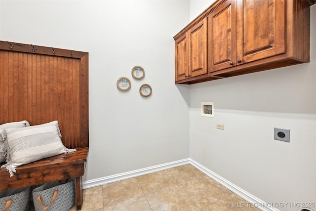 4701 S 179th E Ave, Tulsa, OK 74134 - laundry room featuring hookup for a washing machine, cabinet space, baseboards, electric dryer hookup, and light tile patterned flooring