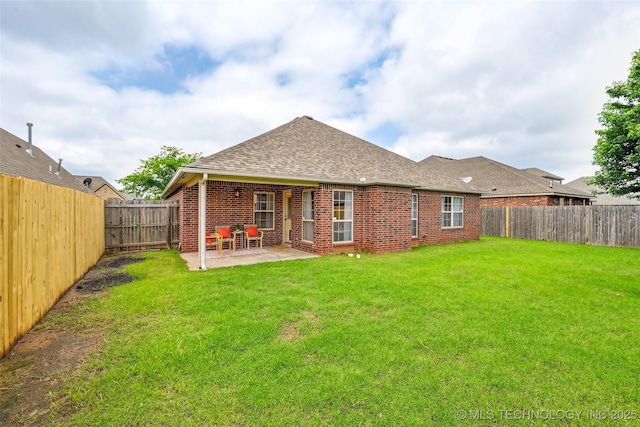 4701 S 179th E Ave, Tulsa, OK 74134 - rear view of house featuring roof with shingles, a patio, and brick siding