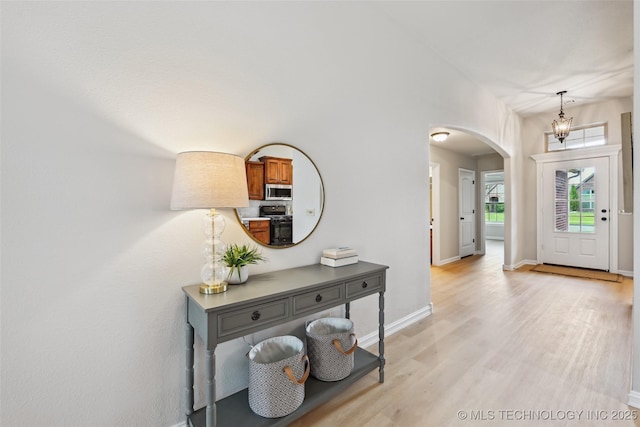 4701 S 179th E Ave, Tulsa, OK 74134 - entryway with arched walkways, light wood-type flooring, and baseboards