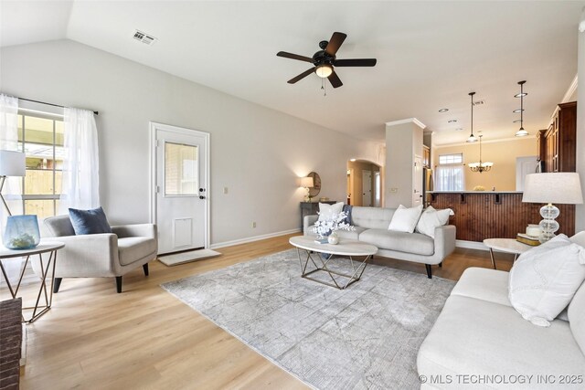 4701 S 179th E Ave, Tulsa, OK 74134 - living room with ceiling fan, light wood-type flooring, arched walkways, baseboards, and lofted ceiling