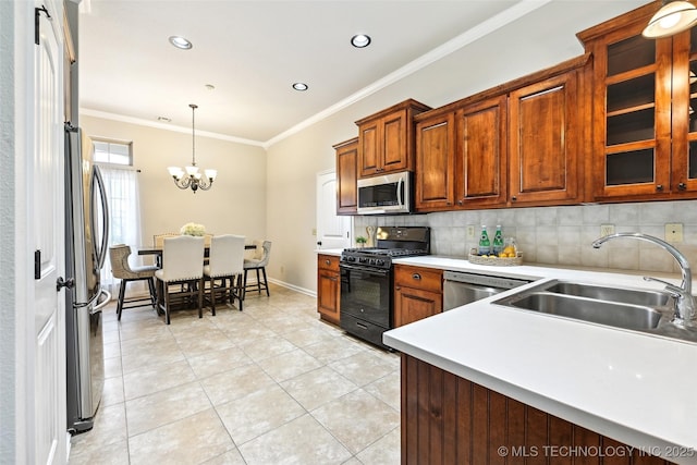 4701 S 179th E Ave, Tulsa, OK 74134 - kitchen with stainless steel appliances, a sink, ornamental molding, light tile patterned flooring, and light countertops