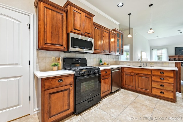 4701 S 179th E Ave, Tulsa, OK 74134 - kitchen with stainless steel appliances, a sink, tasteful backsplash, and light countertops