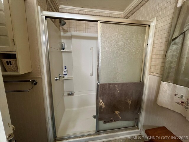 610 W Washington Ave, Krebs, OK 74501 - bathroom with a stall shower and ornamental molding
