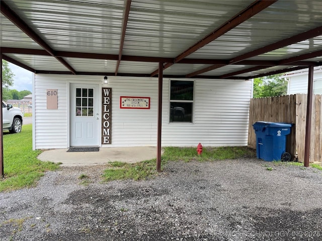 610 W Washington Ave, Krebs, OK 74501 - property entrance with an attached carport