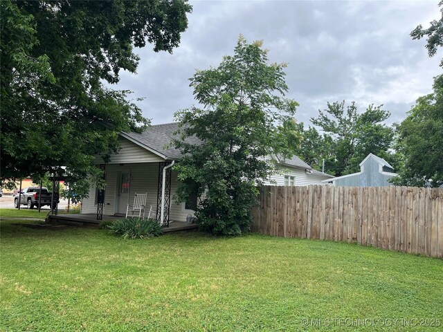 610 W Washington Ave, Krebs, OK 74501 - view of yard featuring covered porch