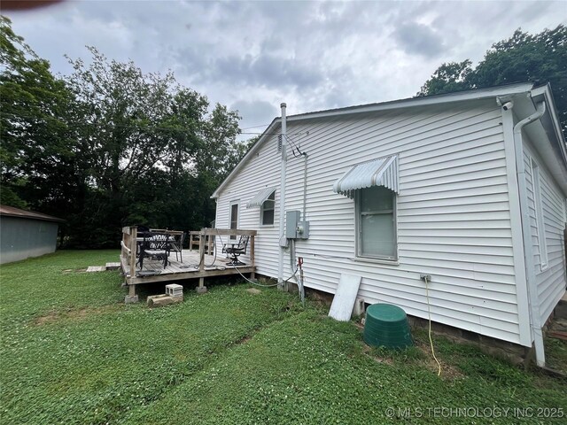 610 W Washington Ave, Krebs, OK 74501 - back of property with a wooden deck and a yard