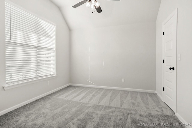 23091 E 107th St S, Broken Arrow, OK 74014 - spare room featuring carpet flooring, a ceiling fan, vaulted ceiling, and baseboards
