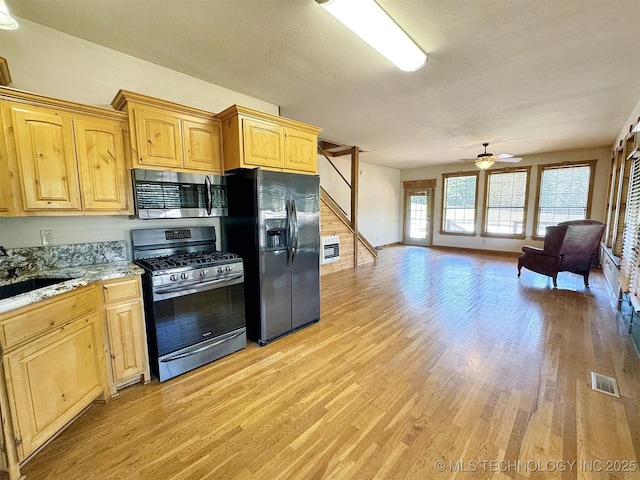 20413 E Allen Rd, Tahlequah, OK 74464 - kitchen featuring stainless steel appliances, open floor plan, light wood-style flooring, a ceiling fan, and light brown cabinetry