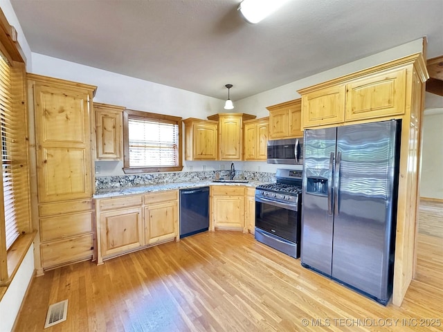 20413 E Allen Rd, Tahlequah, OK 74464 - kitchen featuring stainless steel appliances, light wood-style floors, light brown cabinets, and light stone countertops
