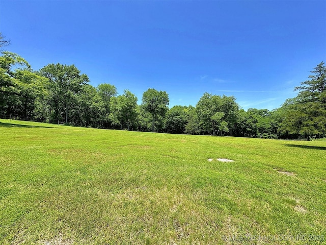 20413 E Allen Rd, Tahlequah, OK 74464 - view of grassy yard featuring a wooded view