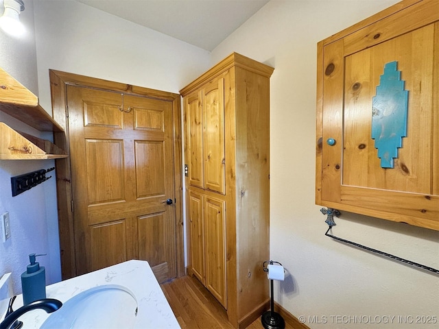 20413 E Allen Rd, Tahlequah, OK 74464 - bathroom with wood finished floors and a sink