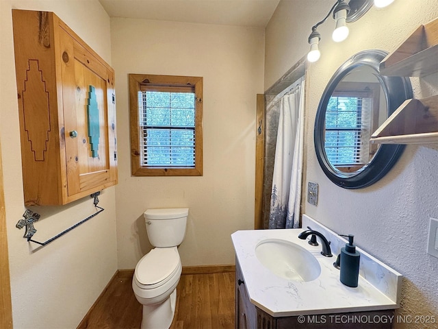20413 E Allen Rd, Tahlequah, OK 74464 - full bathroom with healthy amount of natural light, wood finished floors, and vanity