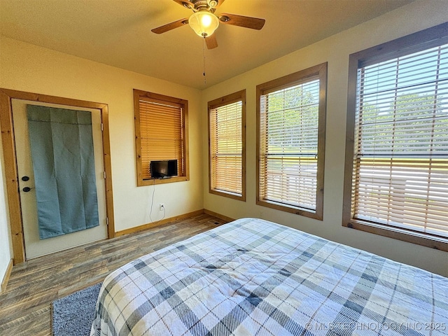20413 E Allen Rd, Tahlequah, OK 74464 - bedroom with wood finished floors and ceiling fan