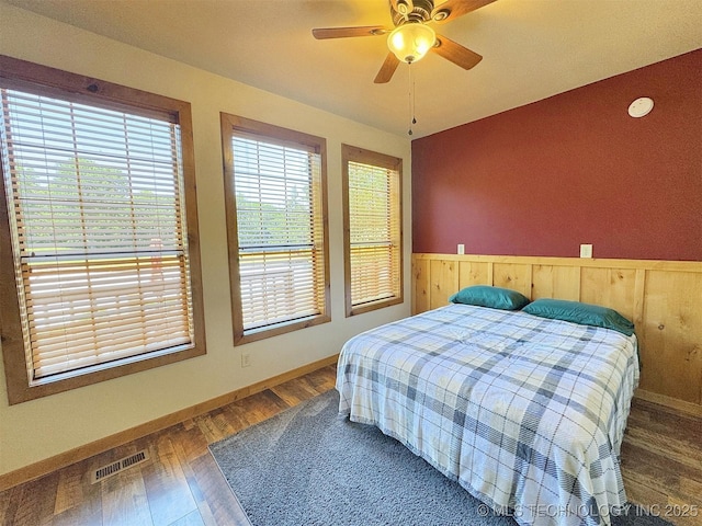 20413 E Allen Rd, Tahlequah, OK 74464 - bedroom featuring a wainscoted wall, wood finished floors, and ceiling fan