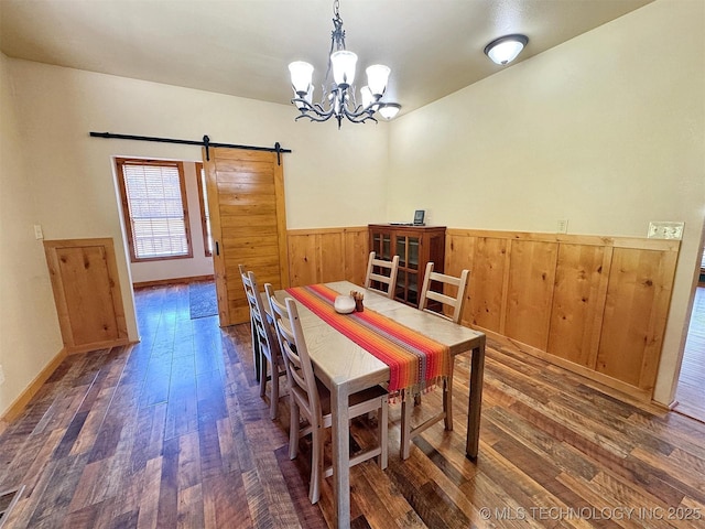 20413 E Allen Rd, Tahlequah, OK 74464 - dining room featuring a barn door, wood-type flooring, wainscoting, a chandelier, and wood walls