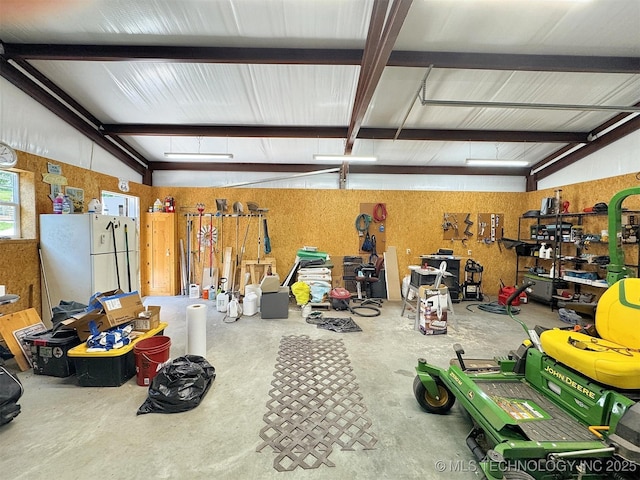 20413 E Allen Rd, Tahlequah, OK 74464 - garage featuring freestanding refrigerator and a workshop area