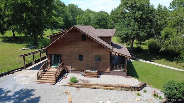 20413 E Allen Rd, Tahlequah, OK 74464 - view of side of property with a lawn, a patio, driveway, roof with shingles, and an attached carport