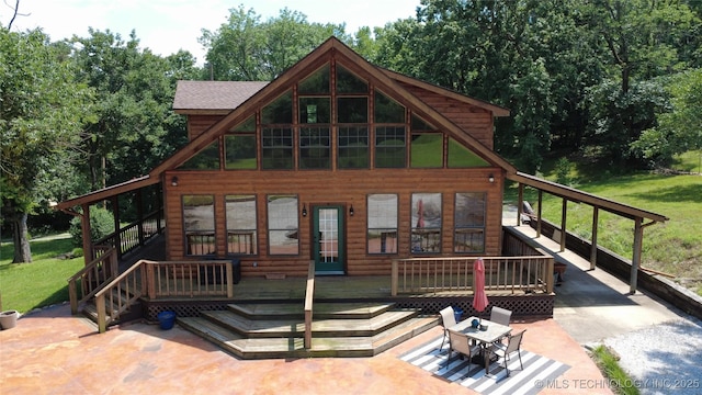20413 E Allen Rd, Tahlequah, OK 74464 - view of front facade featuring log veneer siding, a front yard, and a porch