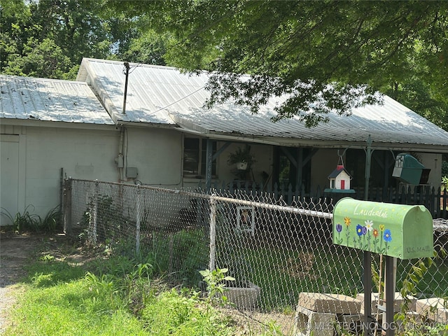 2248 N Darlington Ave, Tulsa, OK 74115 - view of front of house featuring metal roof and concrete block siding