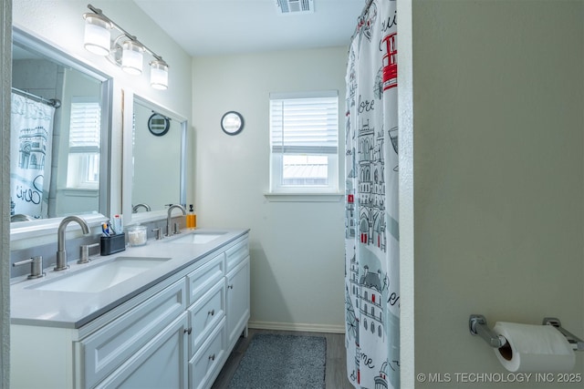 20903 E 35th St S, Broken Arrow, OK 74014 - full bathroom featuring double vanity and baseboards