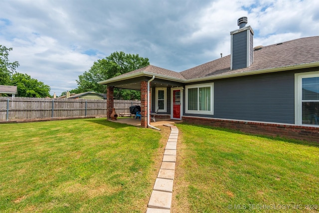 20903 E 35th St S, Broken Arrow, OK 74014 - back of house featuring a patio area, a chimney, and roof with shingles