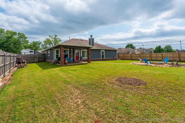 20903 E 35th St S, Broken Arrow, OK 74014 - rear view of house featuring an outdoor fire pit, a patio, and brick siding