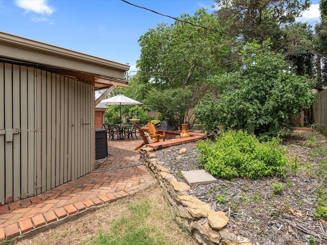 2310 Skyline Dr, Bartlesville, OK 74006 - view of yard featuring a patio area and outdoor dining area