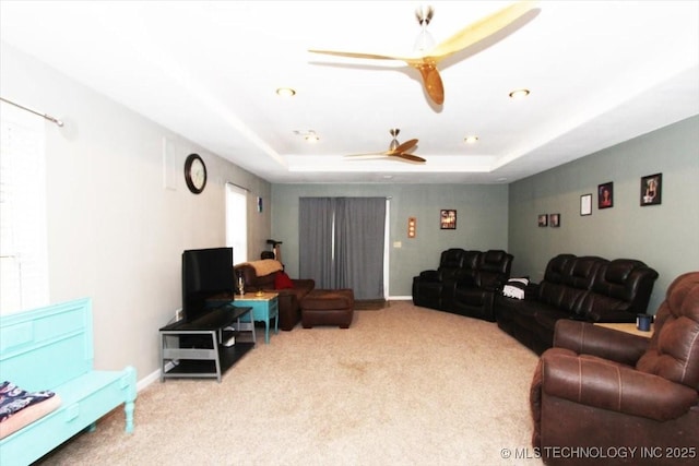 410 Shawnee St, So Coffeyville, OK 74072 - living room with carpet floors, ceiling fan, a tray ceiling, and baseboards