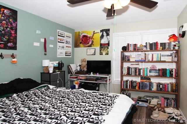 410 Shawnee St, So Coffeyville, OK 74072 - bedroom with ceiling fan and wood finished floors